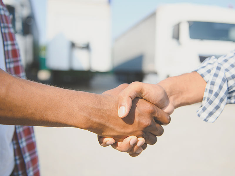 truck drivers shaking hands